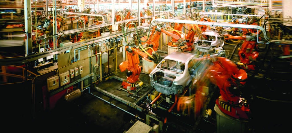 An electric vehicle charges at a power station