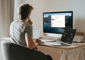 A Professional man working from home using 1password software