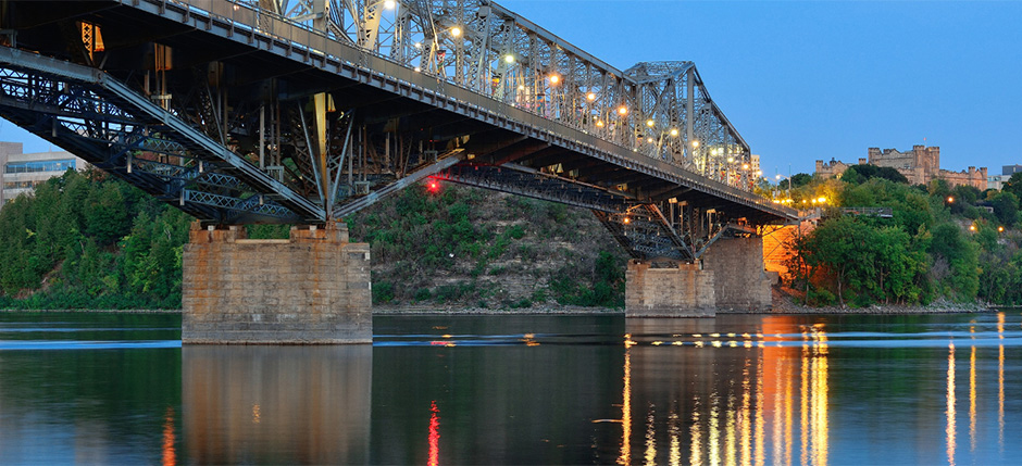 The Royal Alexandra Interprovincial Bridge as seen leading into Ottawa, Ontario, Canada at dusk