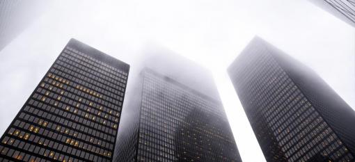 Skyscrapers being blanketed by fog