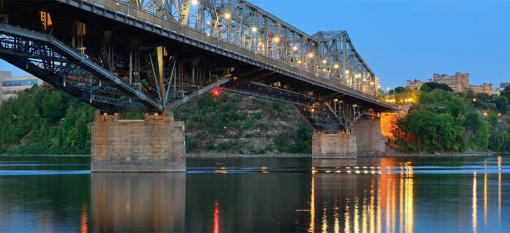 The Royal Alexandra Interprovincial Bridge as seen leading into Ottawa, Ontario, Canada at dusk